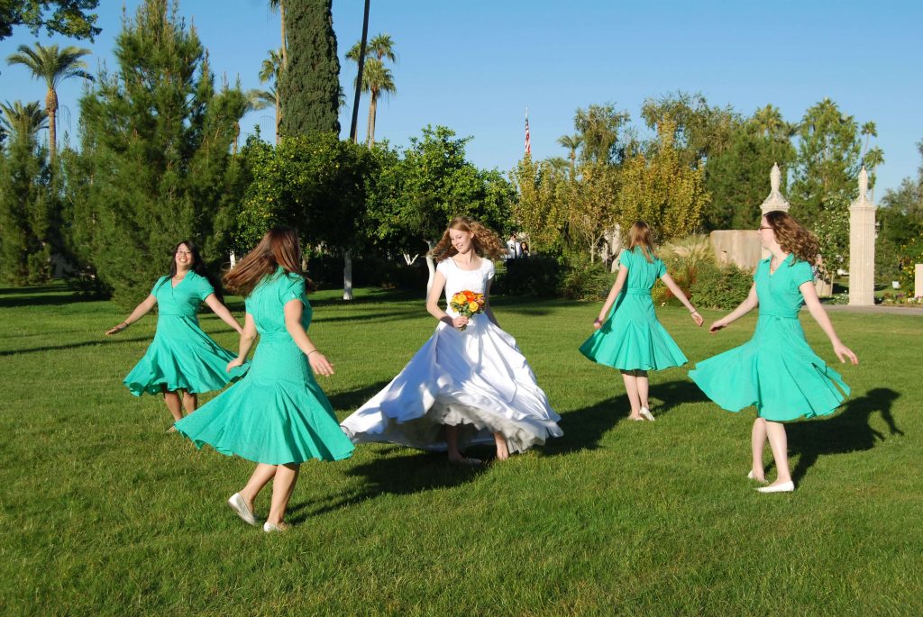 bride and bridesmaid dancing