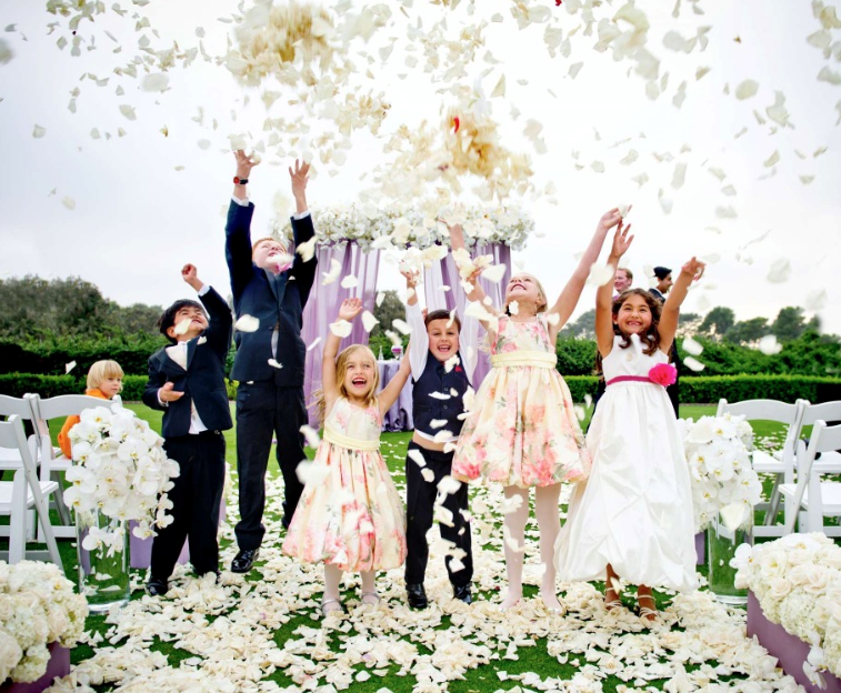flower girl and ring bearer having fun