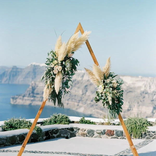 Wooden wedding ceremony backdrop with flowers