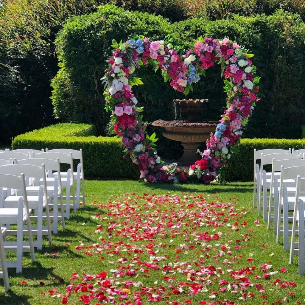 Heart shape floral wedding ceremony backdrop