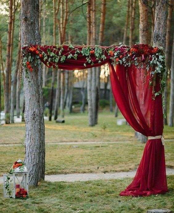nature red drape ceremony backdrop