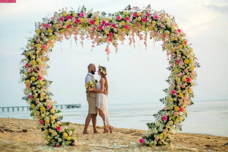 Beach ceremony floral heart shape decor