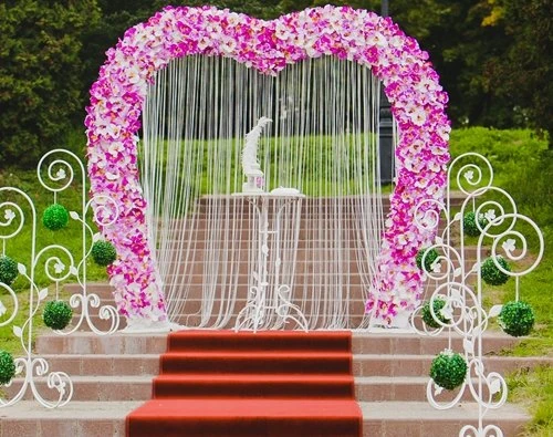pink white flowers heart arch