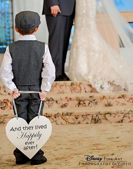 Happily ever after sign held by ring boy