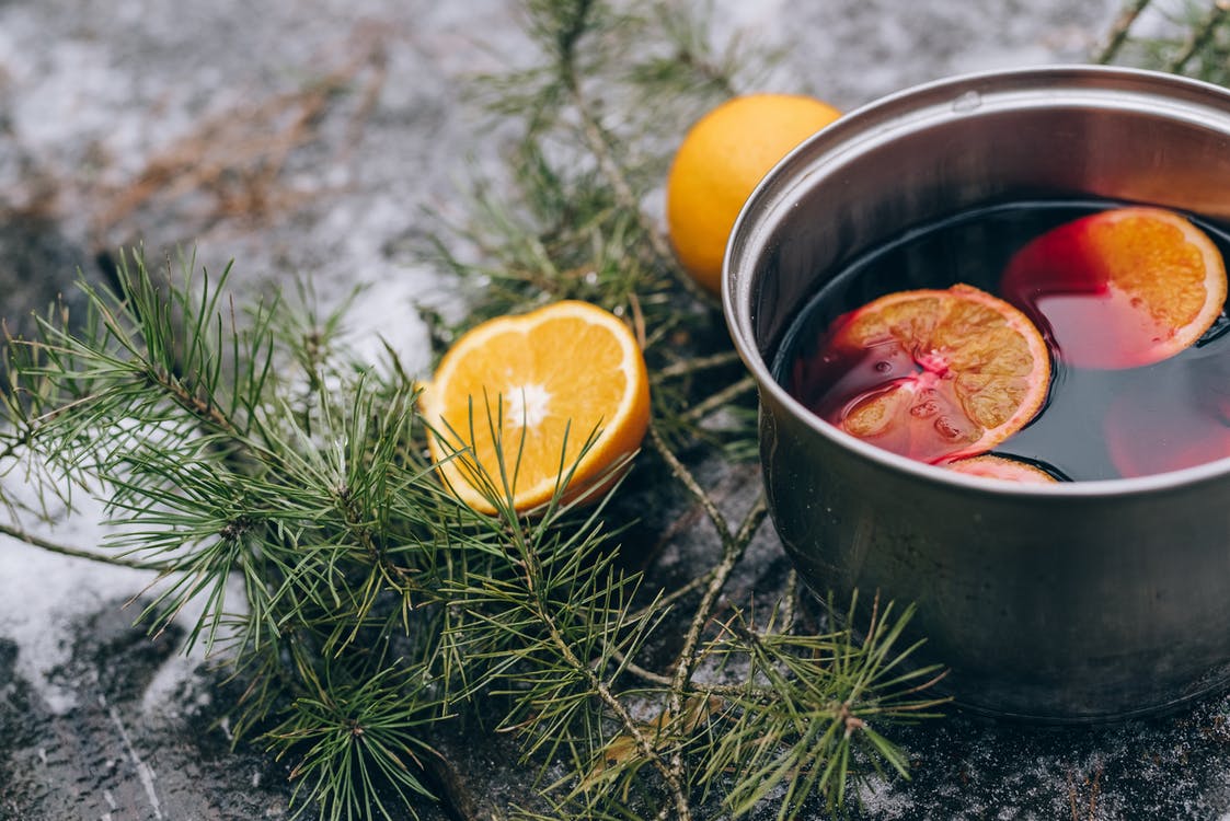 Colored Liquid with Sliced Oranges to keep you warm on your winter wedding